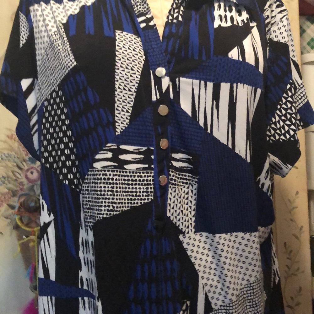 Black and blue shirt  with v-neck and four buttons in the front.